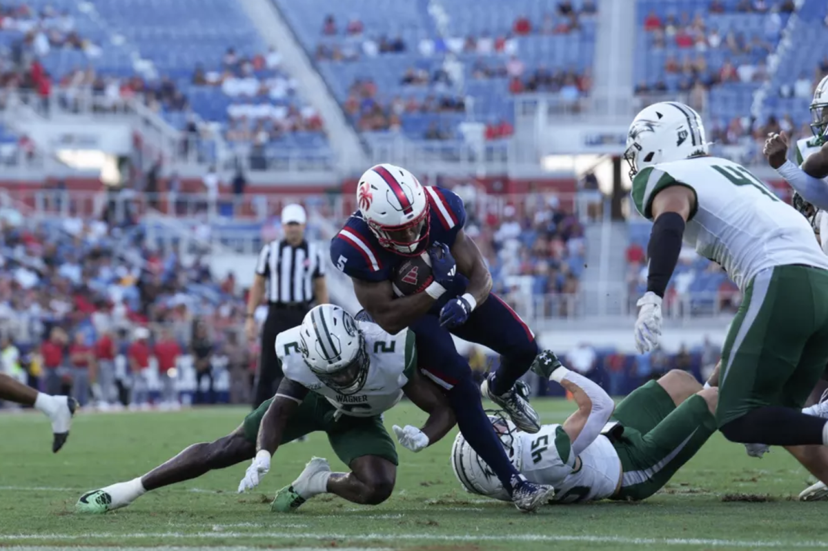 Running back CJ Campbell Jr. getting tackled near the end zone against Wagner University.